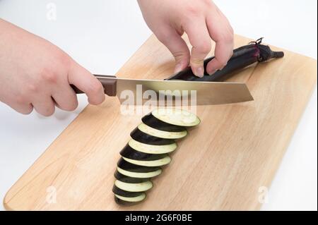 Male Hands Slicing Eggplant Knife Wooden Board Stock Photo by