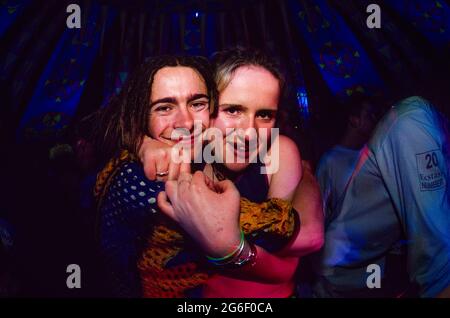 A man and woman hugging at, Tribal Gathering an all night rave held in ...