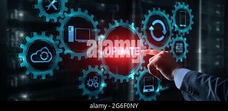 Businessman is pressing on the virtual screen Update Software Computer. Stock Photo