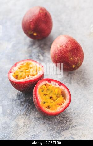 Organic raw passion fruit on kitchen table. Stock Photo