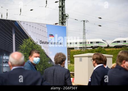 Hamburg, Germany. 05th July, 2021. A poster with the inscription 'Deutschlandtakt' stands at the event to mark the start of construction of the new Hamburg-Altona station. After several years of delay, construction work is starting on the new Altona long-distance train station in Hamburg. It is being built at the current Diebsteich S-Bahn station and is scheduled to replace the Altona terminus station, located around two kilometres to the south, for long-distance and regional services in 2027. Credit: Daniel Reinhardt/dpa/Alamy Live News Stock Photo