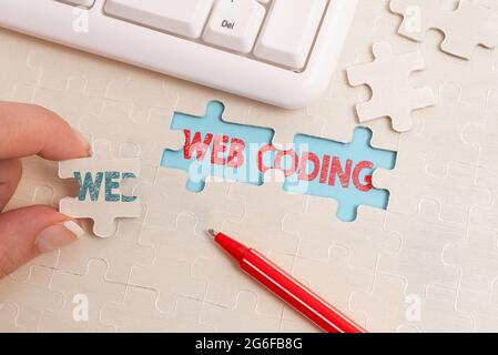 Sign displaying Web Coding. Conceptual photo a system of symbols and rules used to represent instructions Building An Unfinished White Jigsaw Pattern Stock Photo