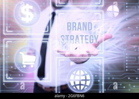 Text showing inspiration Brand Strategy. Business showcase longterm plan executed for the development of a good product Gentelman Uniform Standing Stock Photo