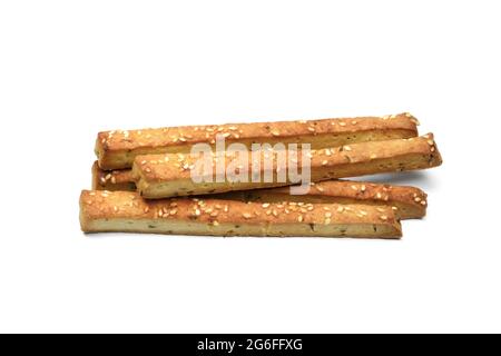 Homemade cheese sticks with cumin and sesame seeds. Bread sticks isolated on whute background. Baked salty sticks with salt and cumin. Stock Photo