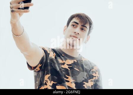 Young man making a selfie with the mobile phone Stock Photo