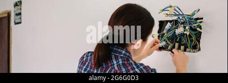 Electrician working on the electrical installation of a house Stock Photo