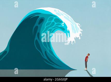 Man facing huge ocean tidal wave Stock Photo