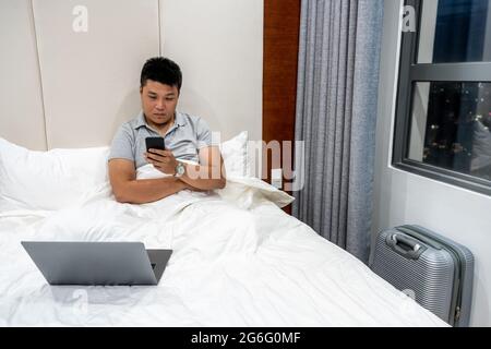 Young man working late at night Stock Photo