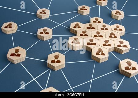 A network of connected people with a large group of employees. Organized communication system between company workers. Decentralized networking commun Stock Photo