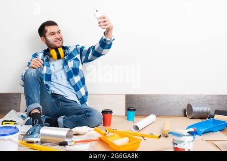 Smiling caucasian man taking selfies photo Stock Photo