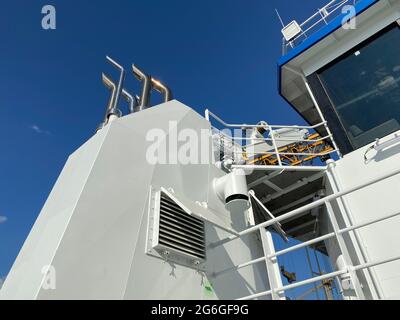 Shiny Exhaust Pipes Coming Out From The White Funnel of A New Fishing Farm Service Boat Stock Photo
