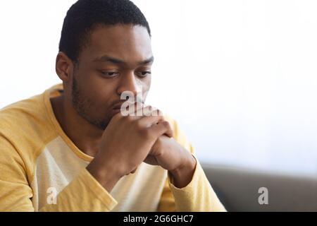 Pensive african american man thinking about something Stock Photo