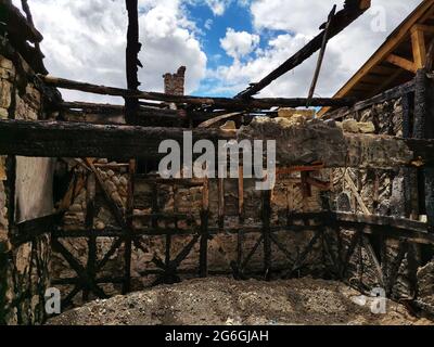 House destroyed in fire. Destroyed house. Ruined house. Stock Photo