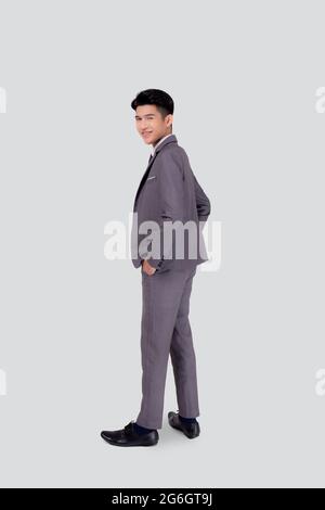 Rear view of young asian businessman in suit hand in pocket with confident isolated on white background, back of business man is manager or executive Stock Photo