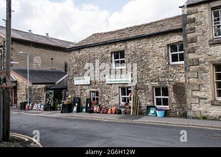 Old shop in the town of  Settle Yorkshire dales showing old traditional houses and shop Stock Photo