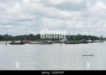 September 12 2020, Babuganj, Barisal, Bangladesh. Small dinghy is floating in the river water.  These boats are inhabited by people Stock Photo