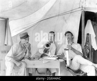 RONALD COLMAN RALPH FORBES and NEIL HAMILTON on set location candid during filming of BEAU GESTE 1926 director HERBERT BRENON novel P.C. Wren Paramount Pictures Stock Photo