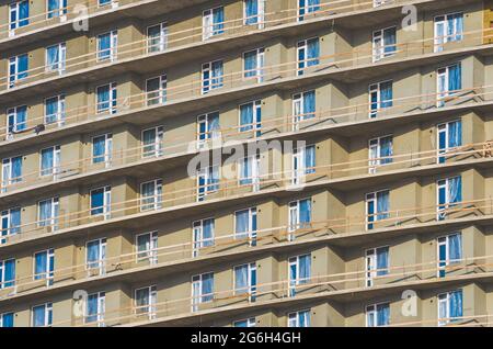 A lot of windows and balconies in the house under construction Stock Photo