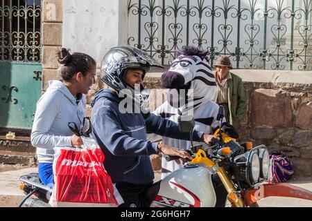 SUCRE, BOLIVIA - APRIL 22, 2015: Zebra traffic warden is helping with the traffic in Sucre, capital of Bolivia Stock Photo
