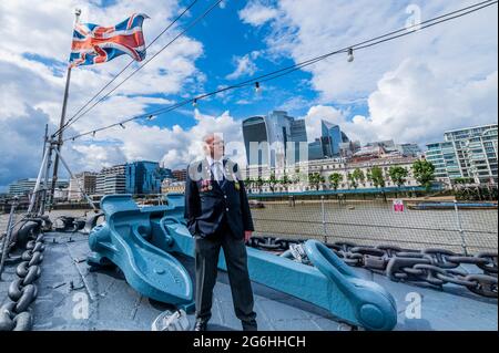 London, UK. 6th July, 2021. On the newly refurbished foredeck - Bernie Bristoll a radio operator and Chief petty Officer in the Royal Navy, served on the ship for 2 years. The Imperial War Museums (IWM) HMS Belfast re-opens after its Covid shutdown and after the refurbishment of many of the displays. Credit: Guy Bell/Alamy Live News Stock Photo