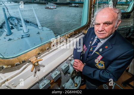 London, UK. 6th July, 2021. On the Captains Bridge - Bernie Bristoll a radio operator and Chief petty Officer in the Royal Navy, served on the ship for 2 years. The Imperial War Museums (IWM) HMS Belfast re-opens after its Covid shutdown and after the refurbishment of many of the displays. Credit: Guy Bell/Alamy Live News Stock Photo