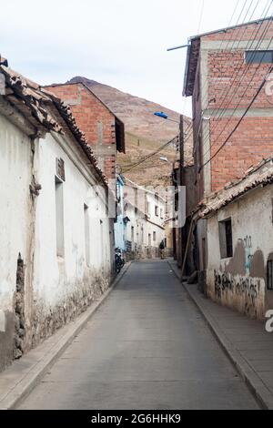 View of a street in a historic center of Potosi, Bolivia. Cerro Rico (Rich Mountain) in background. Stock Photo