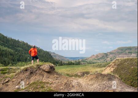 Hiker at Dry Island Buffalo Jump provincial park, a traditional site for the indigenous buffalo hunt. Stock Photo