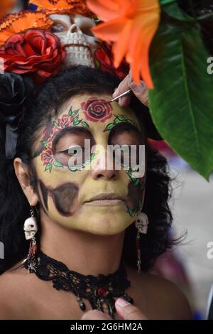 People dress as Catrina, an iconic image for Day of the Dead in Mexico, and participate in a parade the week before Day of the Dead. Stock Photo