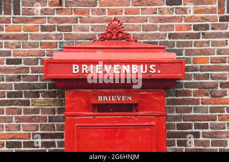 Dutch red mailbox on the wall Stock Photo