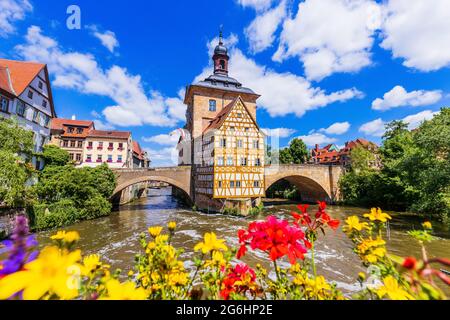 Bamberg, Germany. Town Hall of Bamberg (Altes Rathaus) with two bridges over the Regnitz river. Upper Franconia, Bavaria. Stock Photo