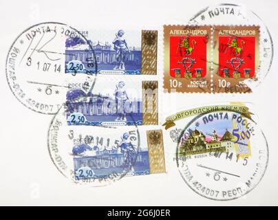 MOSCOW, RUSSIA - MARCH 4, 2020: Postage stamp printed in Russia with stamp of Yoshkar-Ola shows Novgorod Kremlin, Coat of arms of Alexandrov city, Ora Stock Photo