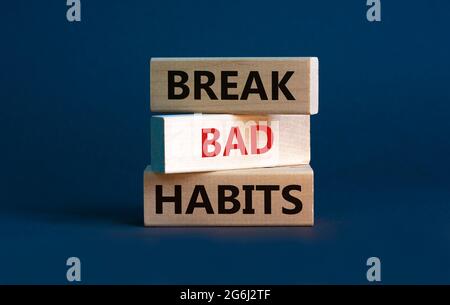 Break bad habits symbol. Wooden blocks with words 'break bad habits ...