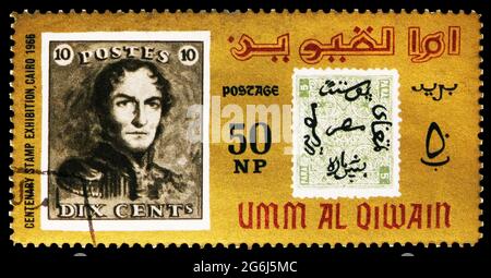 MOSCOW, RUSSIA - MARCH 21, 2020: Postage stamp printed in Umm Al Quwain shows Stamps from Belgium and Egypt, International Stamp Exhibition, Cairo ser Stock Photo