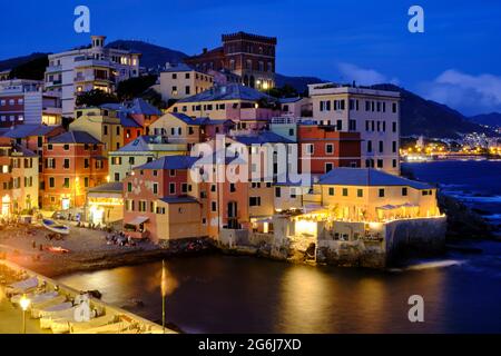 a long exposure photo of Boccadasse beach with the colorful houses and the soft waves behind. Genova, Ligurie, Italy Stock Photo