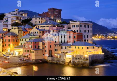 a long exposure photo of Boccadasse beach with the colorful houses and the soft waves behind. Genova, Ligurie, Italy Stock Photo