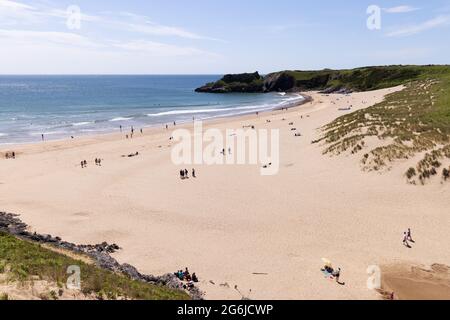 Pembrokeshire coast - people on the uncrowded Broad Haven Beach in summer sunshine, the Stackpole Estate, Pembrokeshire, Wales UK Stock Photo