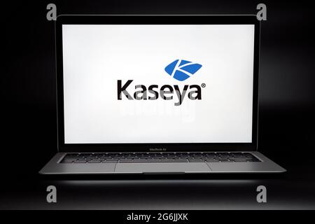 Kaseya company logo on the screen of laptop in dark room. Concept for ransomware attack and security breach.  Stafford, United Kingdom, July 6, 2021. Stock Photo