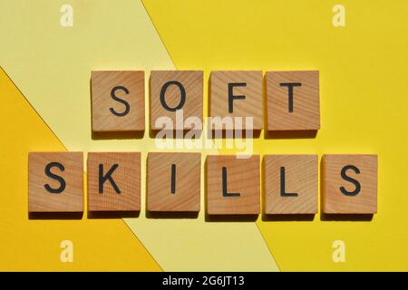 Soft Skills, words in wooden alphabet letters isolated on yellow background as banner headline Stock Photo