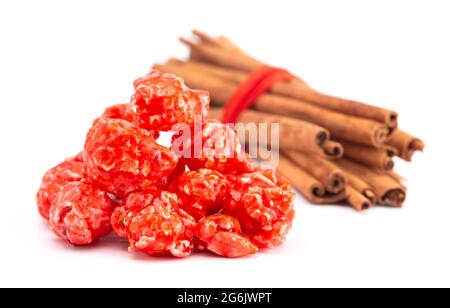 Red Cinnamon Popcorn on a White Background Stock Photo