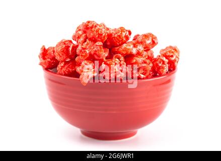 Red Cinnamon Popcorn on a White Background Stock Photo