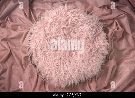 Pink Fur on Crushed Fabric Newborn Backdrop for Photographers with a Single Light Setup Stock Photo