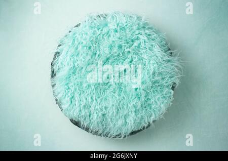 Teal Fur in a Basket Newborn Backdrop for Photographers with a Single Light Setup Stock Photo