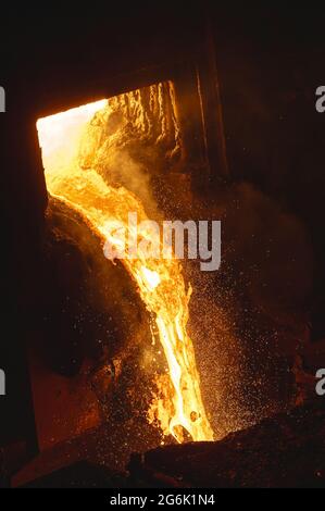 Discharge of liquid metal from a metallurgical furnace Stock Photo