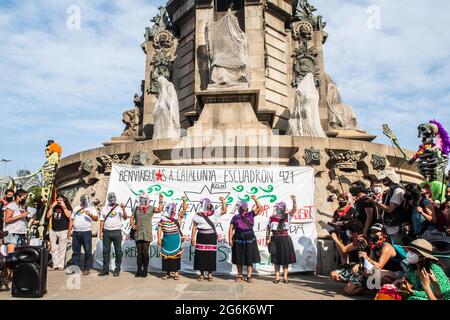 Barcelona, Spain. 06th July, 2021. Members of the Squadron seen at the Columbus Monument, during the event.Barcelona welcomes the 421 Squadron of the Zapatista Army of National Liberation (EZLN), a libertarian socialist political and militant group of Mexico, on their way through Europe. Composed of different members. The 421 Squad has been received at the Columbus Monument by local collectives and social organizations. Credit: SOPA Images Limited/Alamy Live News Stock Photo