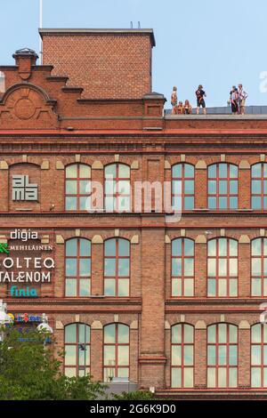 People on the roof of Finlayson old factory building in Tampere Finland  Stock Photo - Alamy