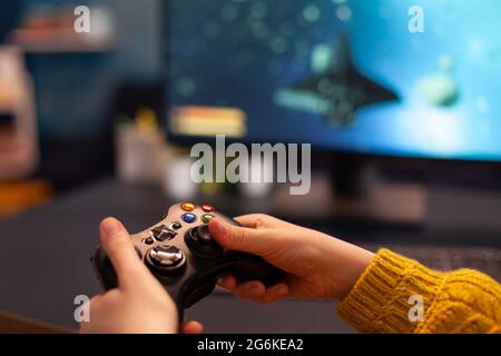 Pro woman egame cyber playing online with virtual reality headset and  wireless controller. Virtual space shooter championship in cyberspace,  esports player performing on pc during gaming tournament Stock Photo - Alamy