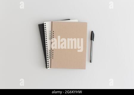 Notebook on grey background. Flat lay composition. Top view. Stock Photo