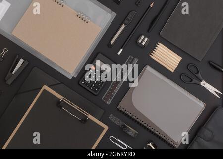 Pattern composition of office and school stationery on black leather background. Back to school Stock Photo