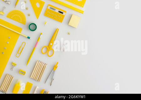 School stationery on a grey background. Top view. Flat lay. Back to school concept. Stock Photo