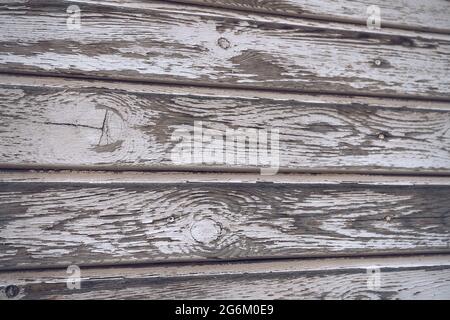 close up view of discolored wooden texture of building facade Stock Photo